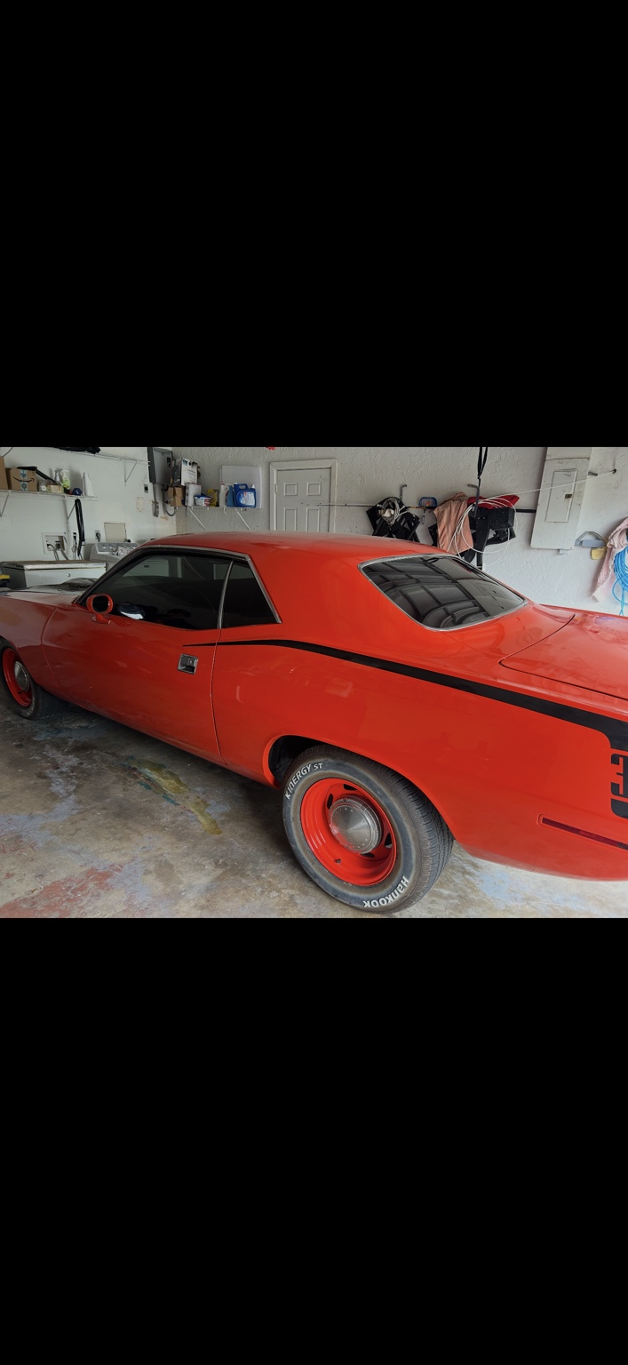 Classic red muscle car with custom window tint