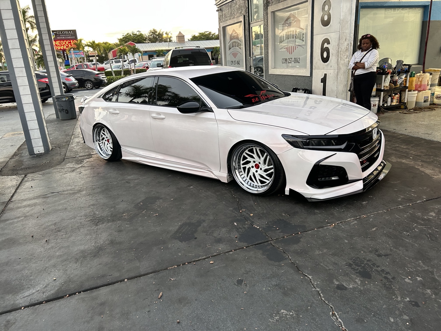 Custom white sedan with tinted windshield and windows