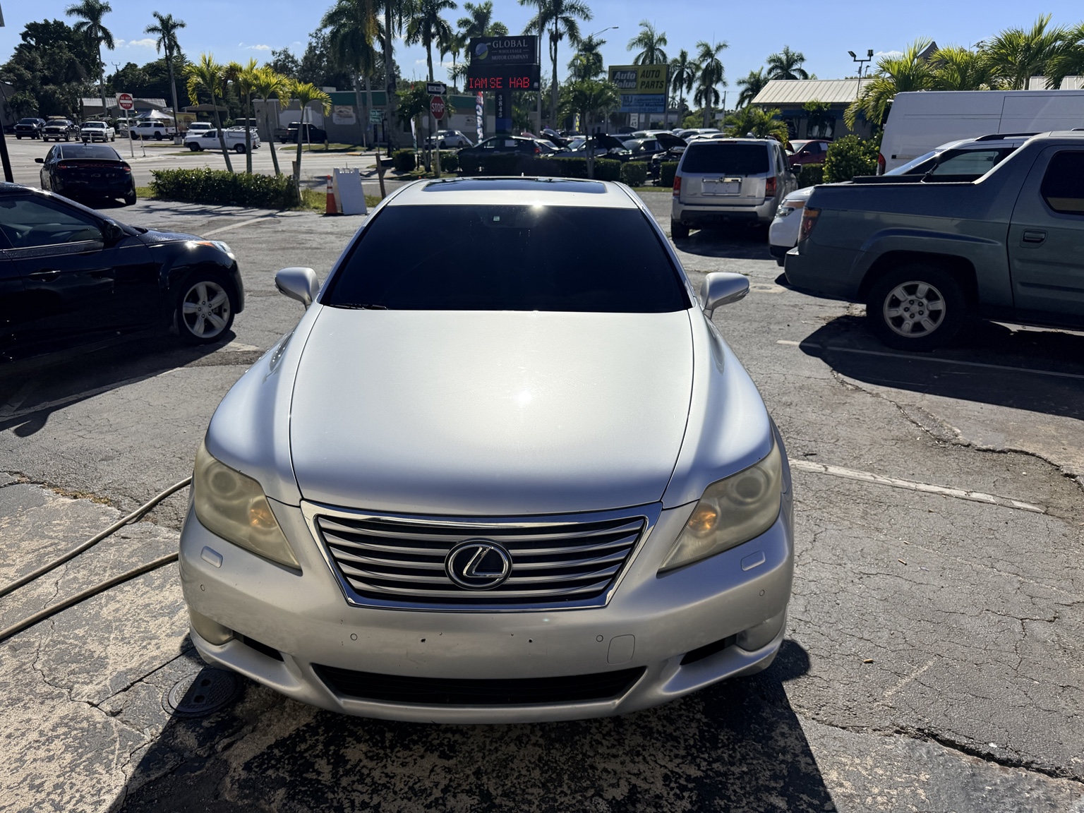 Silver Lexus sedan with dark windshield tint